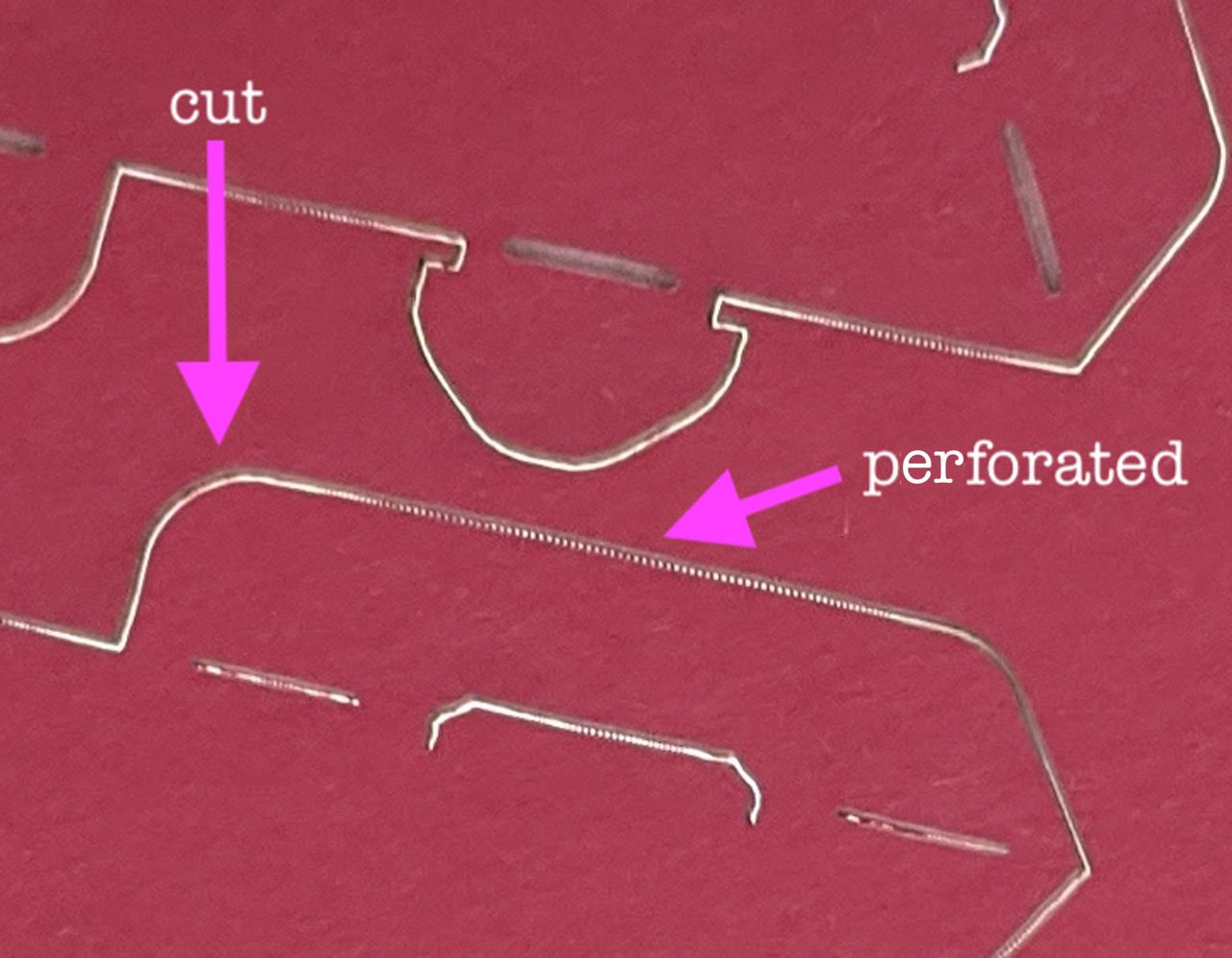 close-up of cardstock laser, cut vs perforated